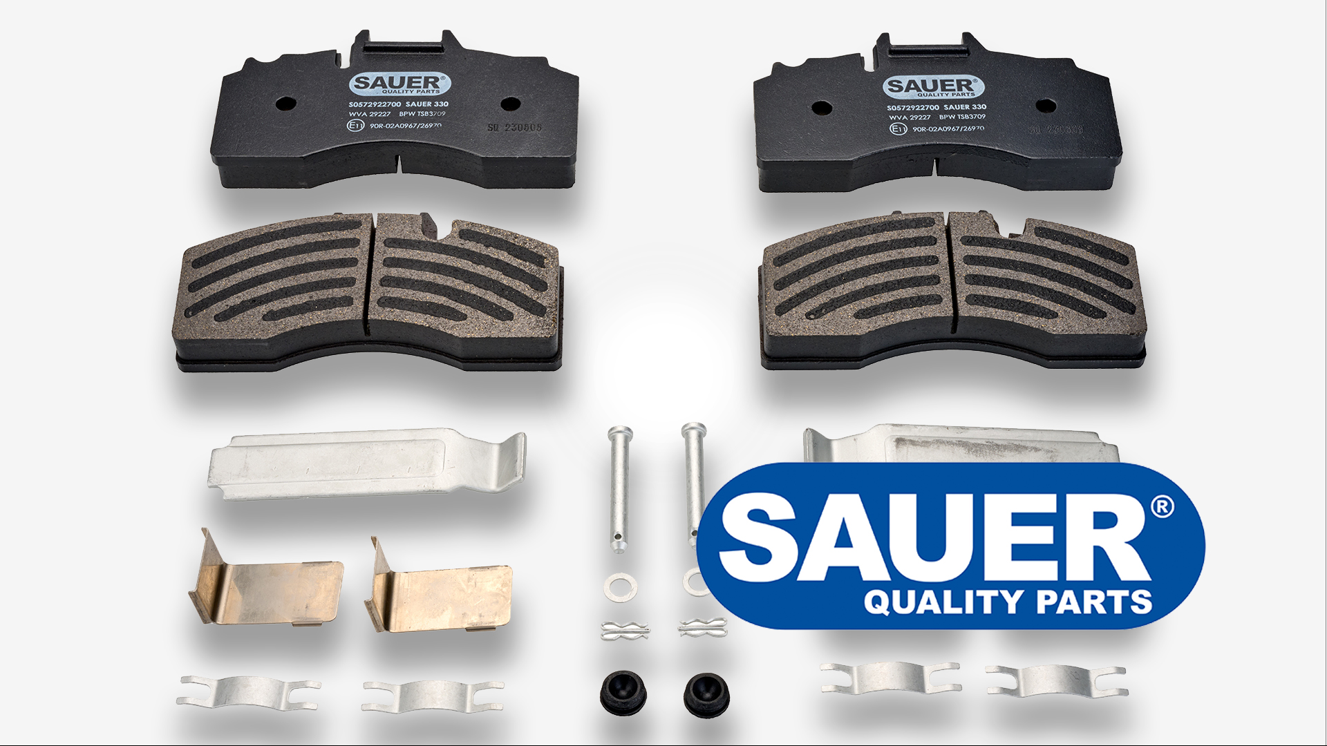 SAUER QUALITY PARTS truck brake pad kit with various metal components and hardware displayed.