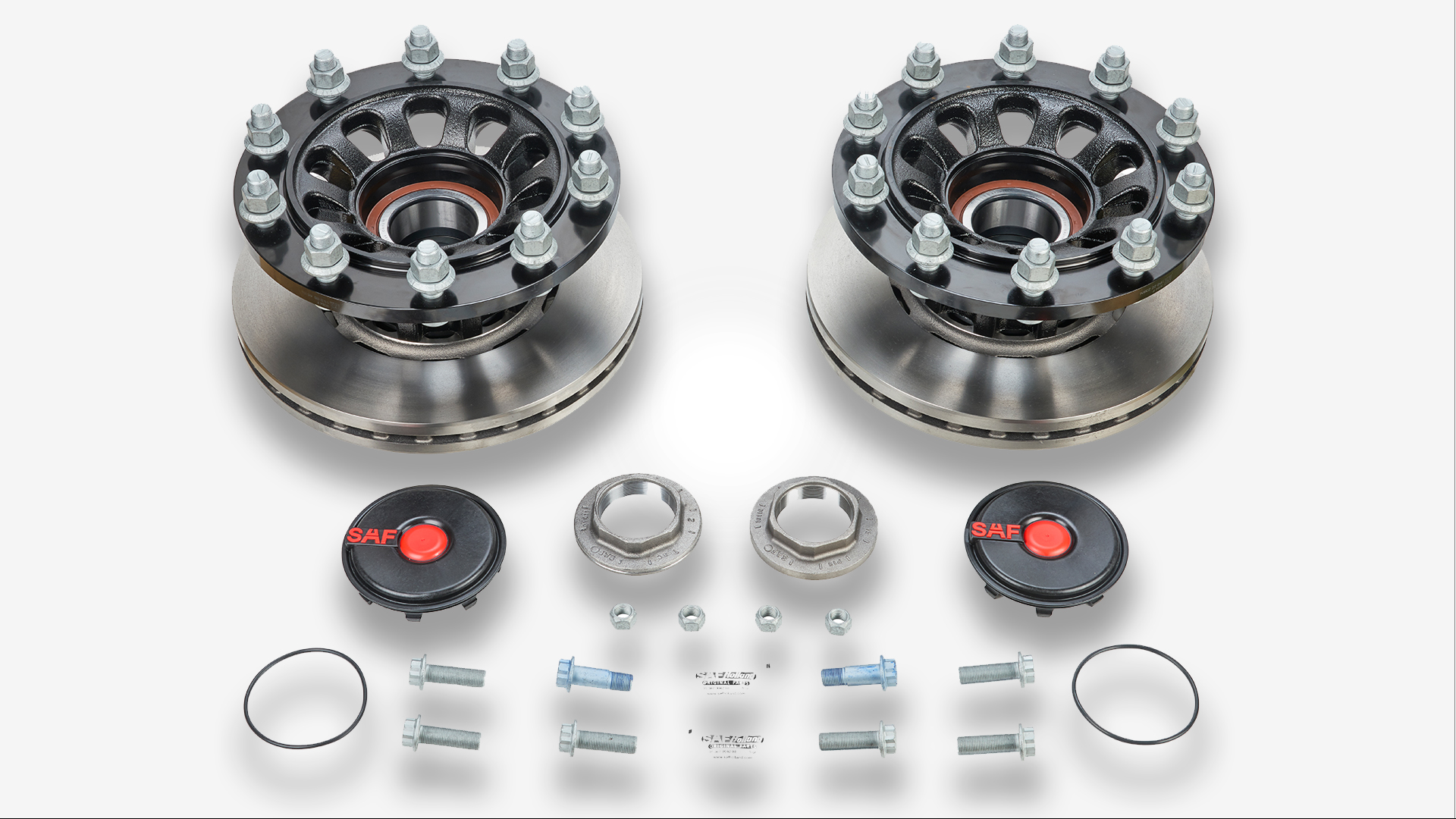 Two SAF wheel hub assemblies with installation components.
